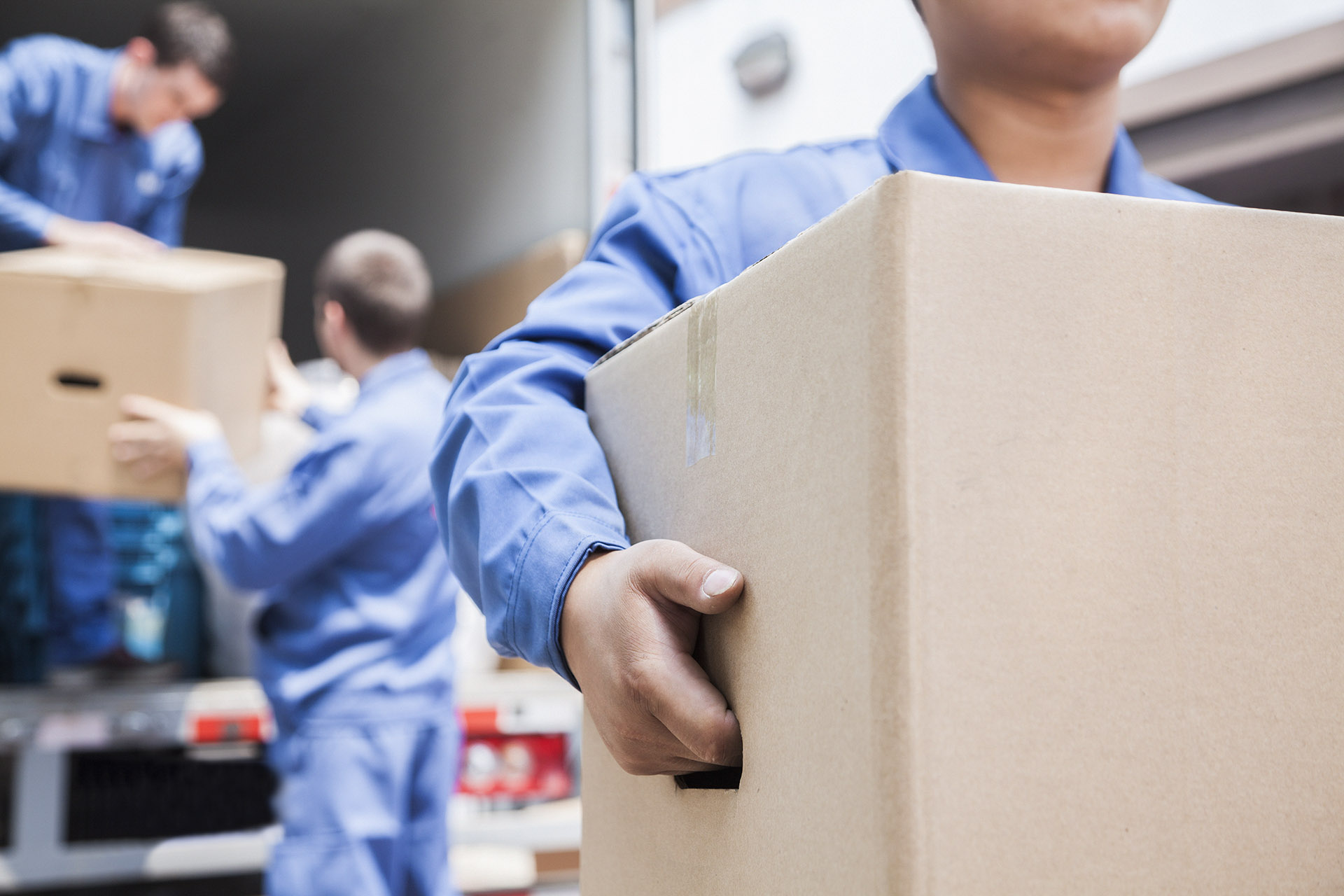 Moving company workers unloading a truck